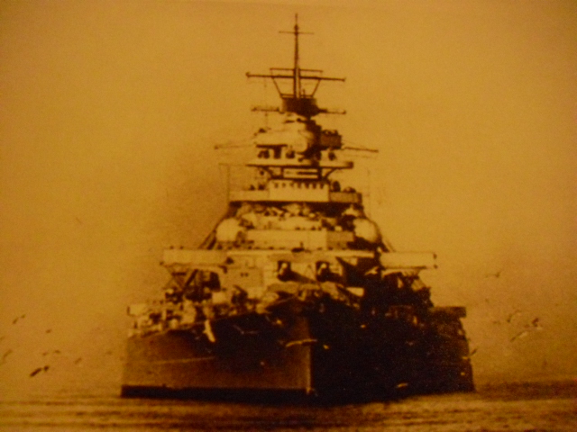 The Bismarck returns up the Elbe 8 December 1940 to complete her yardwork at Blohm &amp; Voss in Hamburg. Her rangefinder cupola and radar antenna have been installed above the foretop, but the cupola has not yet been mounted on top of her forward fire-control station.